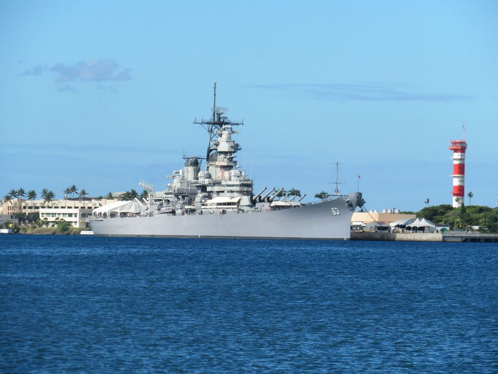 The Battleship Missouri and USS Arizona Memorial are at center stage at Pearl Harbor with the red-and-white World War II control tower in the background and the USS Bowfin submarine nearby. - photos by Joe Alexander