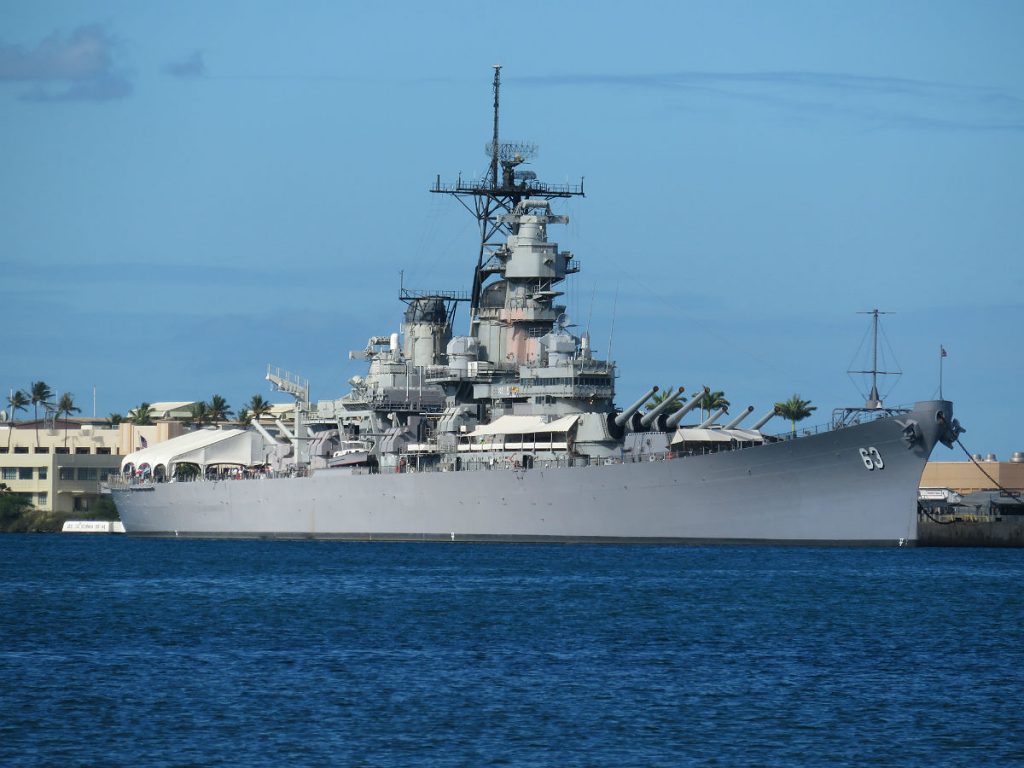The Battleship Missouri and USS Arizona Memorial are at center stage at Pearl Harbor with the red-and-white World War II control tower in the background and the USS Bowfin submarine nearby. - photos by Joe Alexander