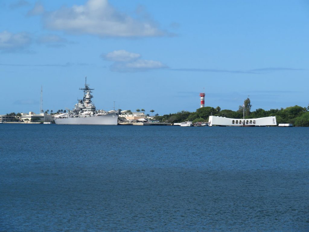 The Battleship Missouri and USS Arizona Memorial are at center stage at Pearl Harbor with the red-and-white World War II control tower in the background and the USS Bowfin submarine nearby. - photos by Joe Alexander