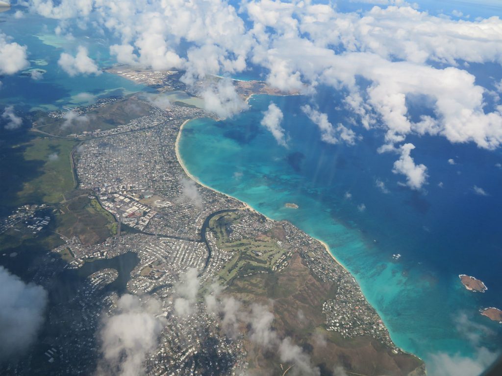 After hours of seeing nothing but sea and sky, you suddenly spot the coast of Oahu as you fly into Honolulu. - photos by Joe Alexander