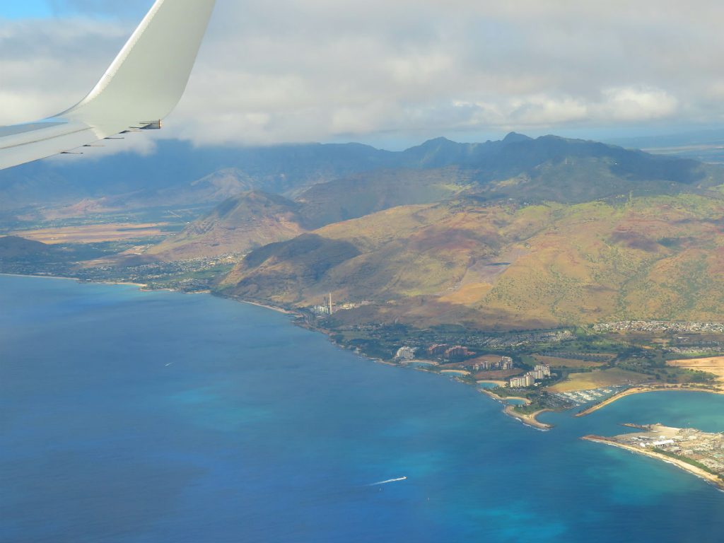 After hours of seeing nothing but sea and sky, you suddenly spot the coast of Oahu as you fly into Honolulu. - photos by Joe Alexander