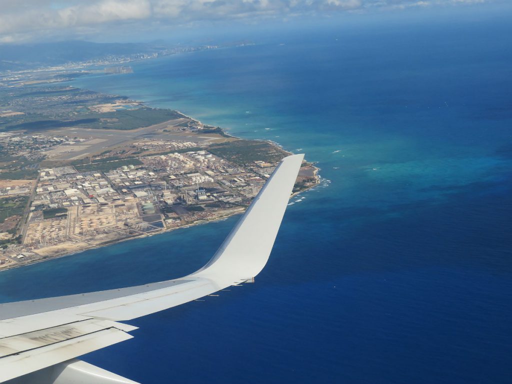 After hours of seeing nothing but sea and sky, you suddenly spot the coast of Oahu as you fly into Honolulu. - photos by Joe Alexander